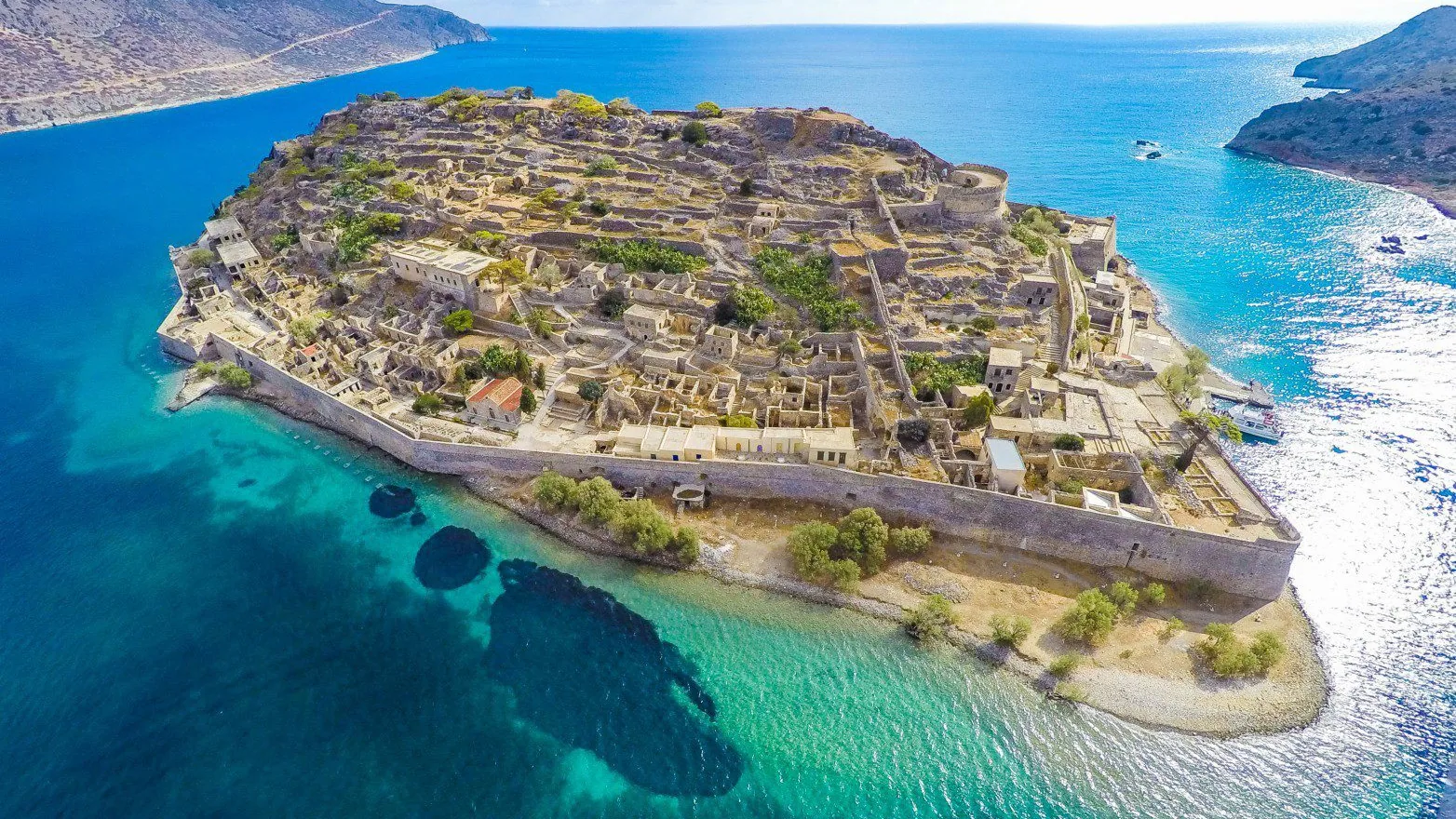 Excursion destination in Crete with turquoise water and historic island ruins