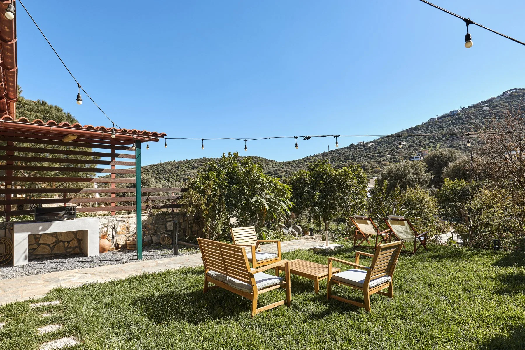 Outdoor BBQ area and citrus garden at Yiamas Seaside Cottage Outdoor BBQ area and citrus garden at Yiamas Seaside Cottage